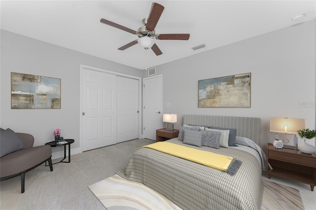 bedroom featuring a closet and a ceiling fan