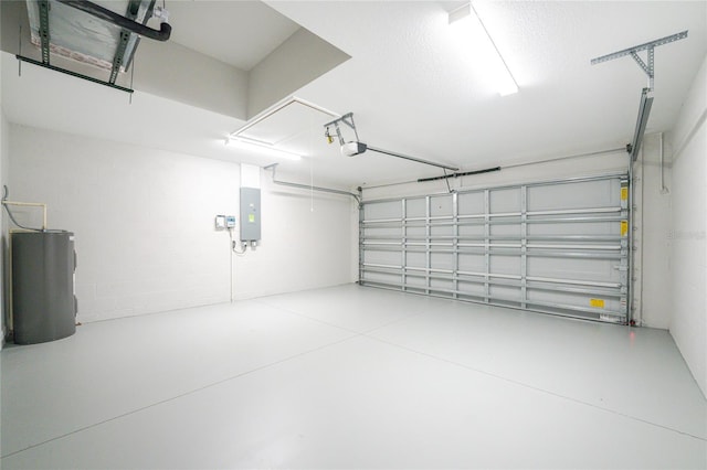 garage featuring electric panel and water heater