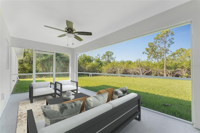 sunroom / solarium featuring an outdoor living space and ceiling fan