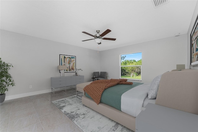 bedroom featuring baseboards and ceiling fan