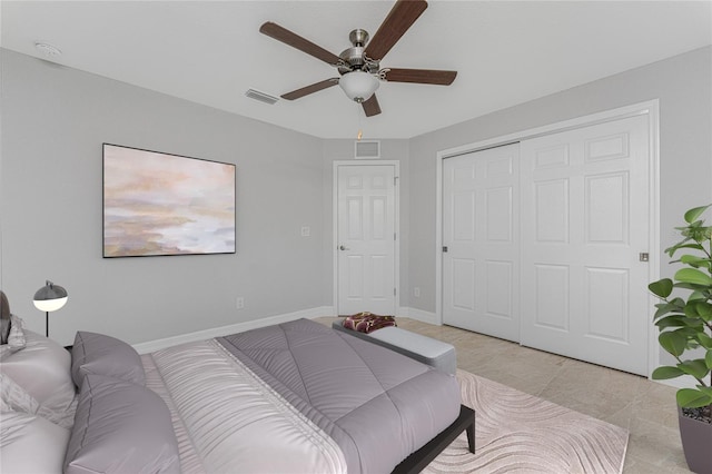 bedroom with a closet, a ceiling fan, and baseboards