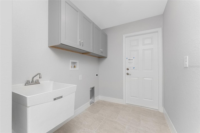 laundry room with cabinet space, hookup for an electric dryer, hookup for a washing machine, and baseboards