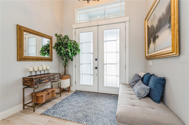 1306 Osprey Dr, Punta Gorda, FL 33950 - entryway featuring french doors, a towering ceiling, and baseboards