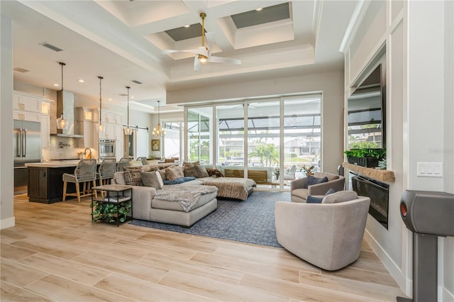 1306 Osprey Dr, Punta Gorda, FL 33950 - living room with a ceiling fan, coffered ceiling, beam ceiling, recessed lighting, and light wood-style floors