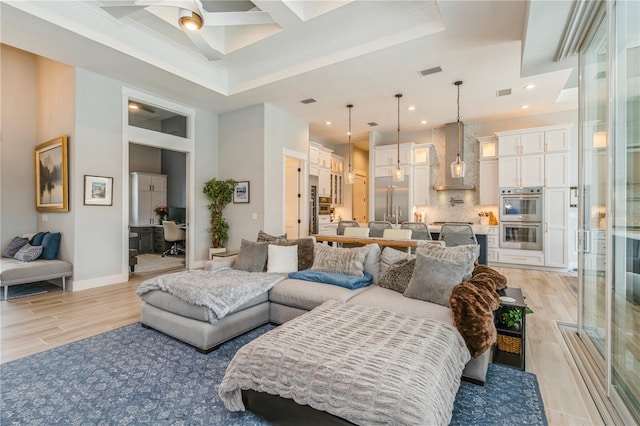 1306 Osprey Dr, Punta Gorda, FL 33950 - living area with a high ceiling, recessed lighting, light wood-style floors, a ceiling fan, and baseboards