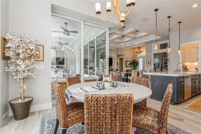 1306 Osprey Dr, Punta Gorda, FL 33950 - dining space with coffered ceiling, a chandelier, light wood-style flooring, a ceiling fan, and beamed ceiling