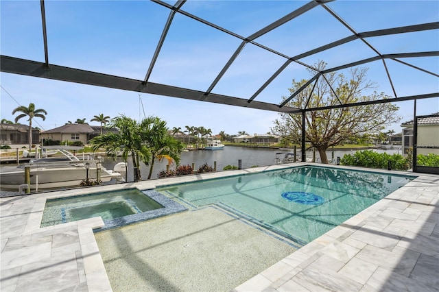 1306 Osprey Dr, Punta Gorda, FL 33950 - view of swimming pool featuring a water view, a patio area, a lanai, and a pool with connected hot tub