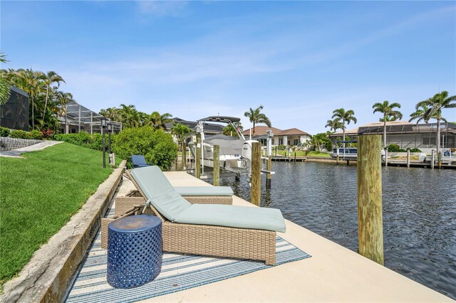 1306 Osprey Dr, Punta Gorda, FL 33950 - dock area featuring a water view, boat lift, a lawn, and a residential view