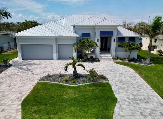 1306 Osprey Dr, Punta Gorda, FL 33950 - view of front of property featuring a standing seam roof, stucco siding, and metal roof