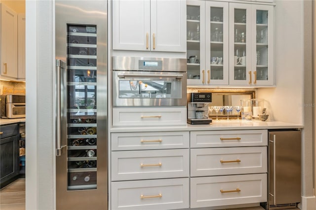 1306 Osprey Dr, Punta Gorda, FL 33950 - bar area with stainless steel oven and refrigerator