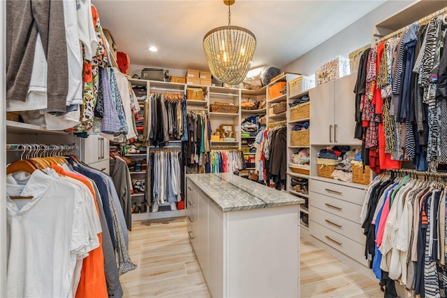 1306 Osprey Dr, Punta Gorda, FL 33950 - spacious closet featuring a chandelier and light wood finished floors