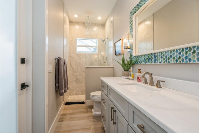 1306 Osprey Dr, Punta Gorda, FL 33950 - full bath featuring vanity, a walk in shower, toilet, baseboards, and recessed lighting