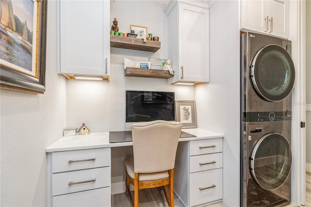 1306 Osprey Dr, Punta Gorda, FL 33950 - office space featuring stacked washer / drying machine, built in study area, and wood finished floors