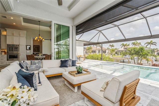 1306 Osprey Dr, Punta Gorda, FL 33950 - living room featuring a chandelier, a raised ceiling, and recessed lighting