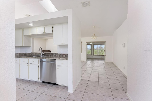 25046 Doredo Dr, Punta Gorda, FL 33955 - kitchen with dishwasher, a sink, light tile patterned flooring, white cabinetry, and dark countertops