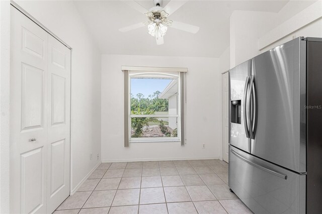 25046 Doredo Dr, Punta Gorda, FL 33955 - kitchen with stainless steel fridge with ice dispenser, ceiling fan, baseboards, and light tile patterned floors