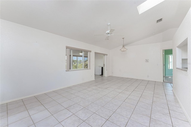 25046 Doredo Dr, Punta Gorda, FL 33955 - unfurnished room with vaulted ceiling, a ceiling fan, a skylight, and light tile patterned floors