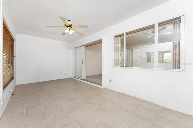 25046 Doredo Dr, Punta Gorda, FL 33955 - empty room with a ceiling fan and plenty of natural light