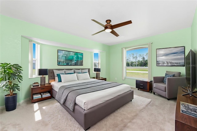 25046 Doredo Dr, Punta Gorda, FL 33955 - bedroom featuring light carpet, baseboards, and ceiling fan