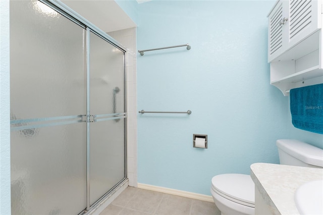 25046 Doredo Dr, Punta Gorda, FL 33955 - bathroom with toilet, a stall shower, tile patterned floors, and baseboards