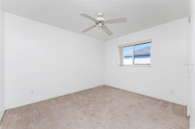 25046 Doredo Dr, Punta Gorda, FL 33955 - unfurnished room with carpet flooring, a ceiling fan, and baseboards