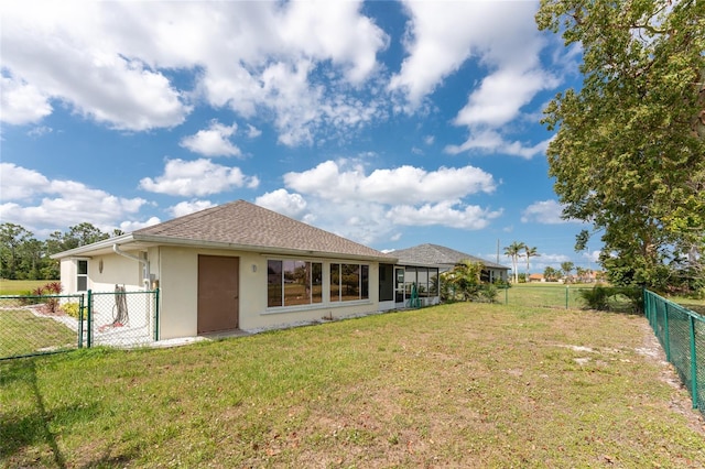 25046 Doredo Dr, Punta Gorda, FL 33955 - rear view of house featuring stucco siding, a gate, and roof with shingles
