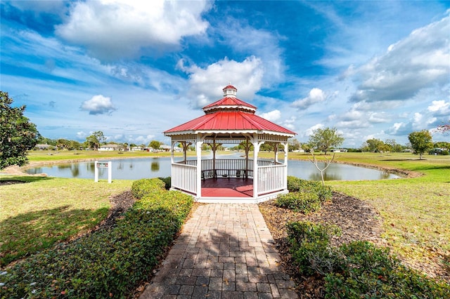 25046 Doredo Dr, Punta Gorda, FL 33955 - dock area featuring a gazebo, a water view, and a yard