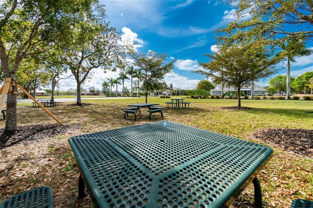 25046 Doredo Dr, Punta Gorda, FL 33955 - view of property's community with a yard