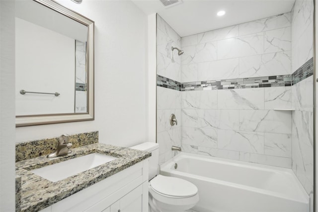 full bathroom with  shower combination, vanity, and toilet
