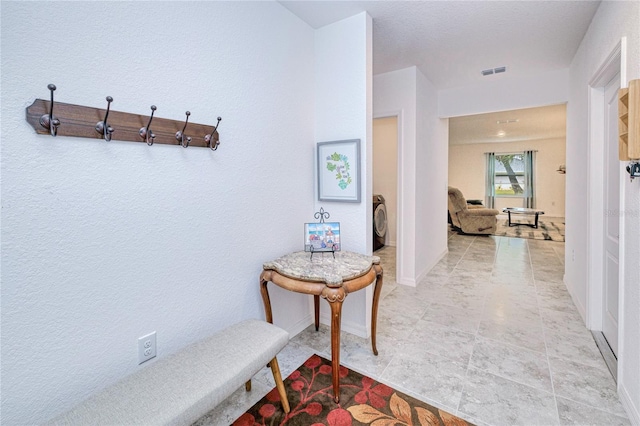 25324 Aysen Dr, Punta Gorda, FL 33983 - hall with washer / clothes dryer and baseboards