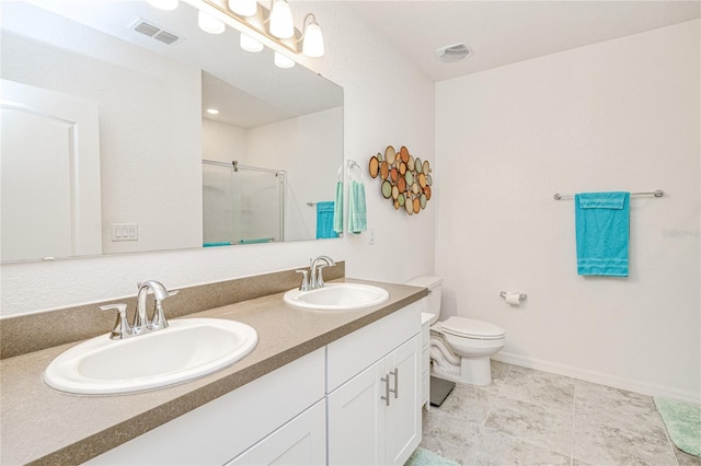25324 Aysen Dr, Punta Gorda, FL 33983 - bathroom with a stall shower, toilet, double vanity, and baseboards