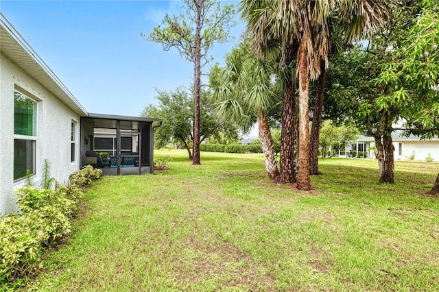 25324 Aysen Dr, Punta Gorda, FL 33983 - view of green lawn with a sunroom