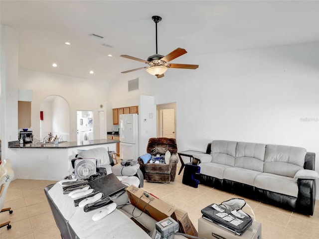 8377 Mambo Ave, North Port, FL 34291 - living room with a ceiling fan, light tile patterned floors, high vaulted ceiling, and recessed lighting