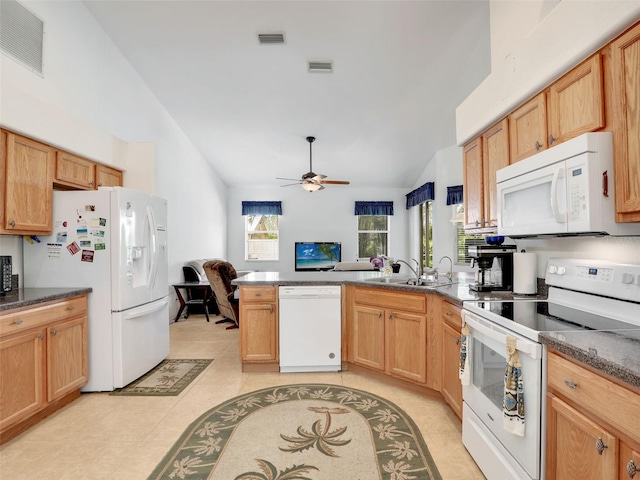 8377 Mambo Ave, North Port, FL 34291 - kitchen featuring white appliances, a sink, lofted ceiling, a peninsula, and a ceiling fan