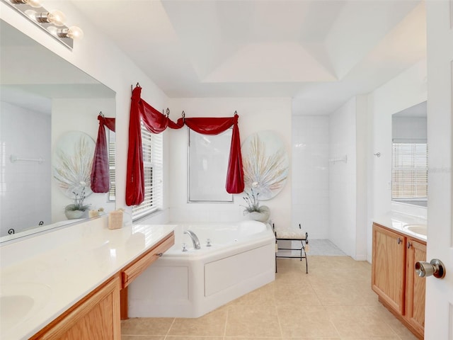 8377 Mambo Ave, North Port, FL 34291 - full bathroom featuring vanity, a garden tub, a walk in shower, and tile patterned floors