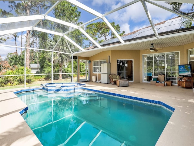 8377 Mambo Ave, North Port, FL 34291 - view of swimming pool with a patio area, ceiling fan, a pool with connected hot tub, and a lanai
