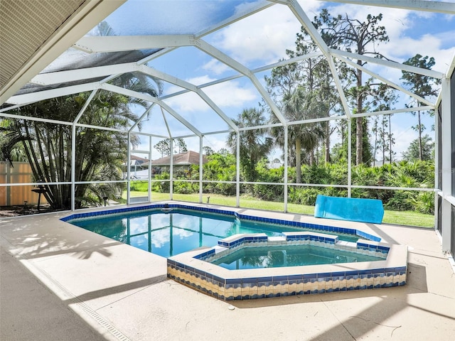 8377 Mambo Ave, North Port, FL 34291 - view of pool featuring a pool with connected hot tub, a patio area, and a lanai