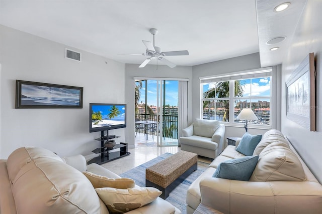 living room featuring healthy amount of natural light, a ceiling fan, and recessed lighting