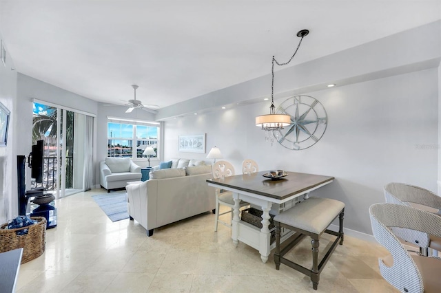 dining space featuring ceiling fan