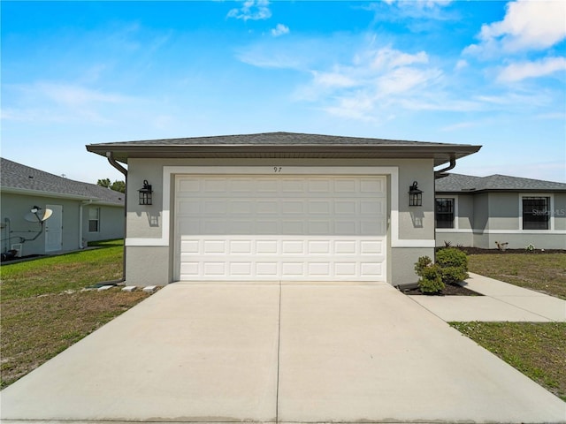 97 Pine Valley Ln, Rotonda West, FL 33947 - view of front facade featuring stucco siding, driveway, and an attached garage