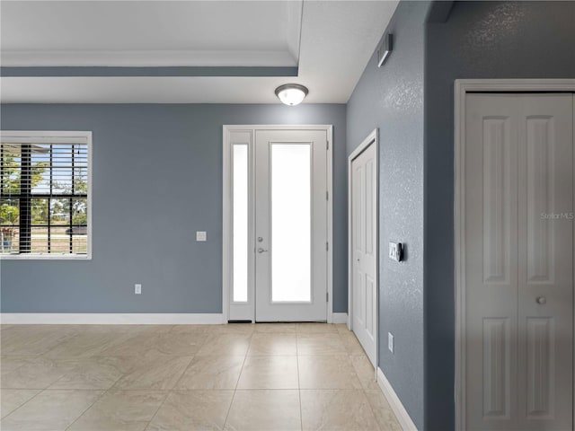 97 Pine Valley Ln, Rotonda West, FL 33947 - entrance foyer featuring baseboards and a raised ceiling