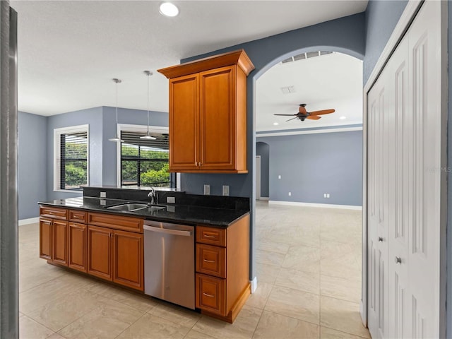 97 Pine Valley Ln, Rotonda West, FL 33947 - kitchen with stainless steel dishwasher, a sink, arched walkways, a ceiling fan, and brown cabinets