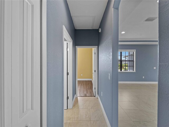97 Pine Valley Ln, Rotonda West, FL 33947 - hallway featuring light tile patterned floors and baseboards