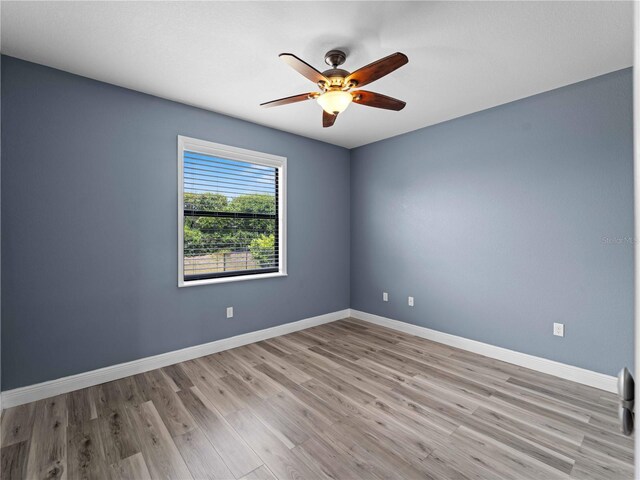 97 Pine Valley Ln, Rotonda West, FL 33947 - spare room featuring ceiling fan, light wood-style flooring, and baseboards