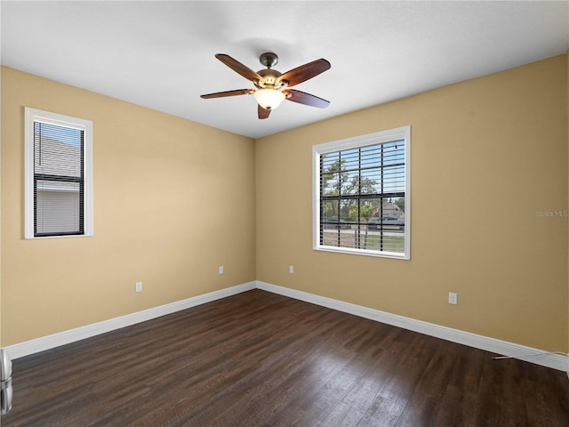 97 Pine Valley Ln, Rotonda West, FL 33947 - spare room featuring baseboards, dark wood-style floors, and ceiling fan