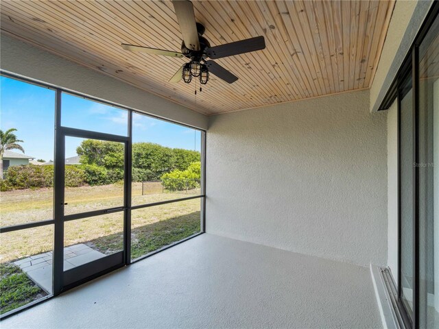 97 Pine Valley Ln, Rotonda West, FL 33947 - unfurnished sunroom with a ceiling fan