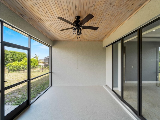 97 Pine Valley Ln, Rotonda West, FL 33947 - unfurnished sunroom with plenty of natural light