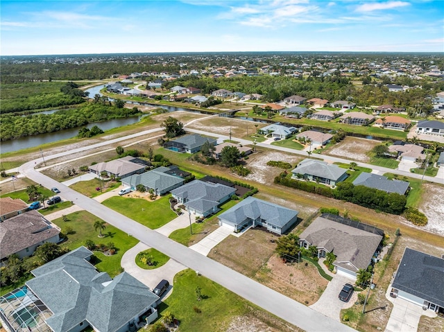 97 Pine Valley Ln, Rotonda West, FL 33947 - aerial view of property's location with a large body of water and nearby suburban area