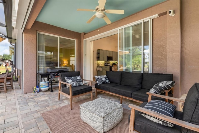 view of patio / terrace featuring an outdoor hangout area and a ceiling fan