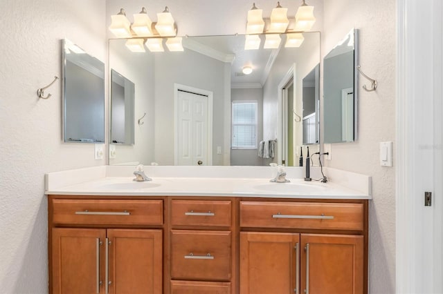 full bathroom featuring double vanity, a textured wall, and crown molding